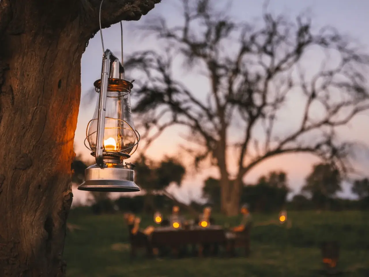 Lantern dinner dusk at Mogotlho Safari Lodge, Khwai River