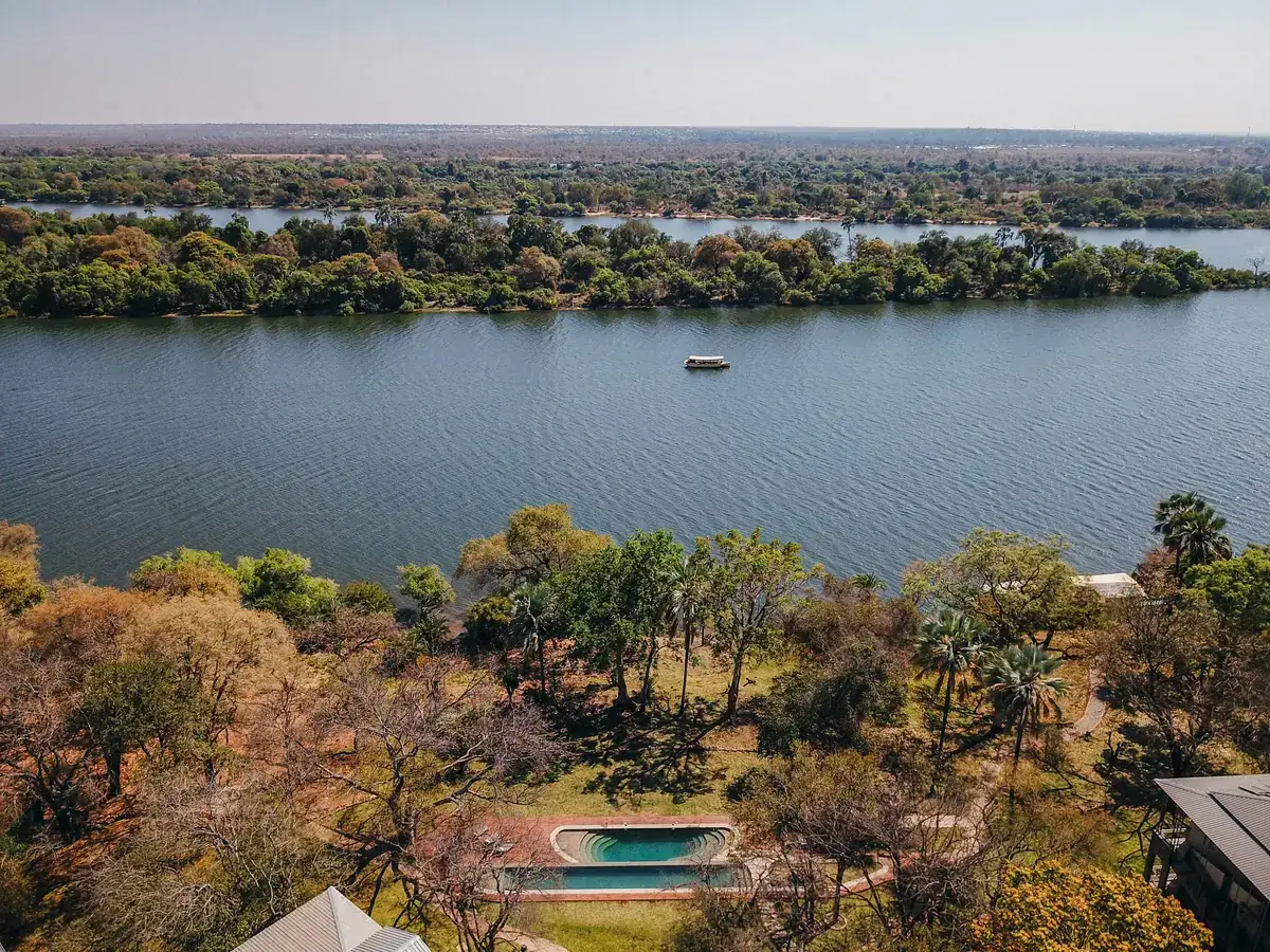 Aerial view of the pool and Zambezi River at The Palm River Hotel