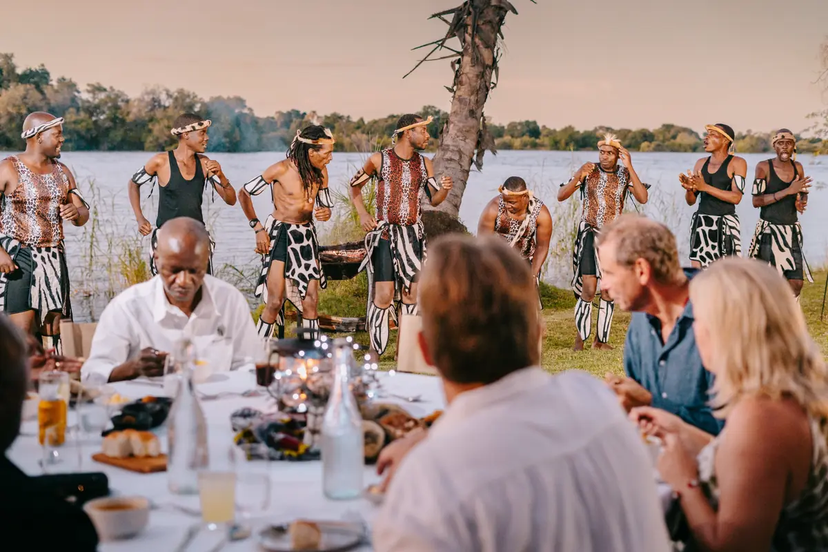 Riverside Dining Experience with traditional entertainment at The Palm River Hotel